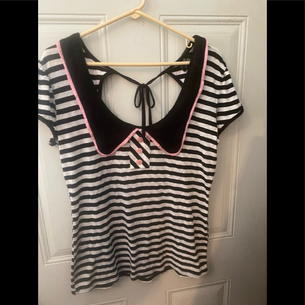 rocksteady shirt, pink button details, tie back, black and white striped.